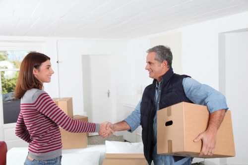Local removal van supporting flat removals in Upminsterbridge near residential buildings