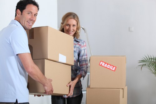 Professional movers handling boxes and furniture